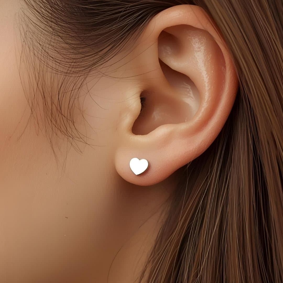 Bright silver heart stud earrings in stainless steel