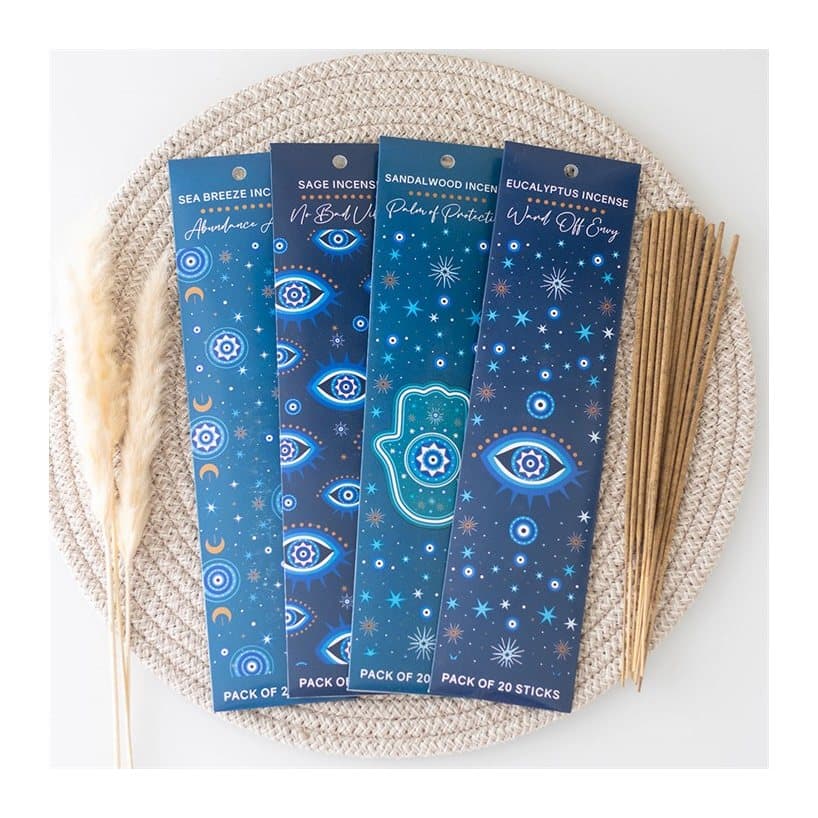 Four packs of incense sticks with celestial designs in a colour cardboard box