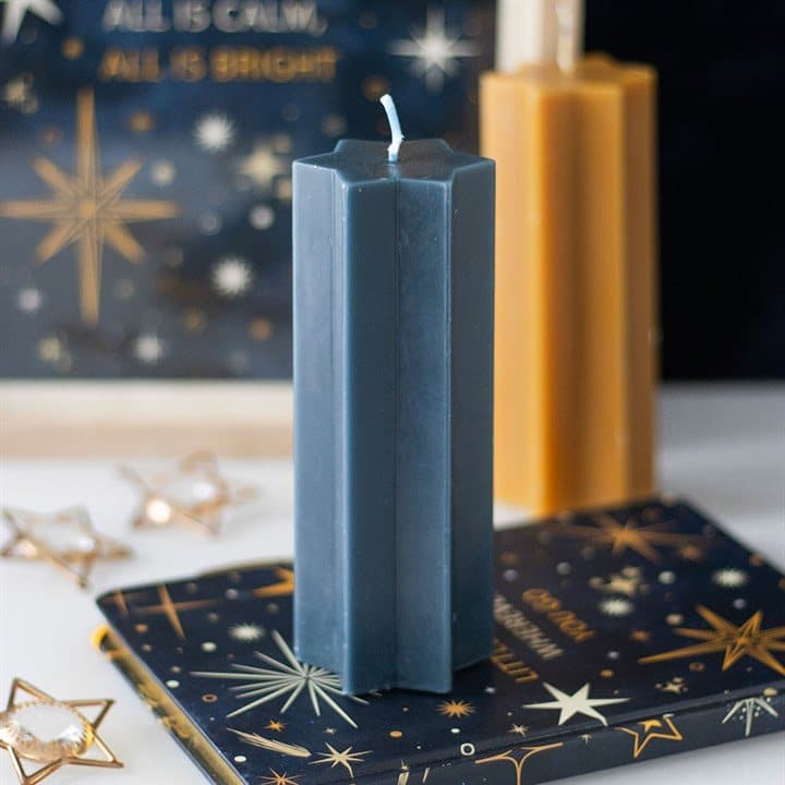 Star-shaped taper candle in navy, gold and cream