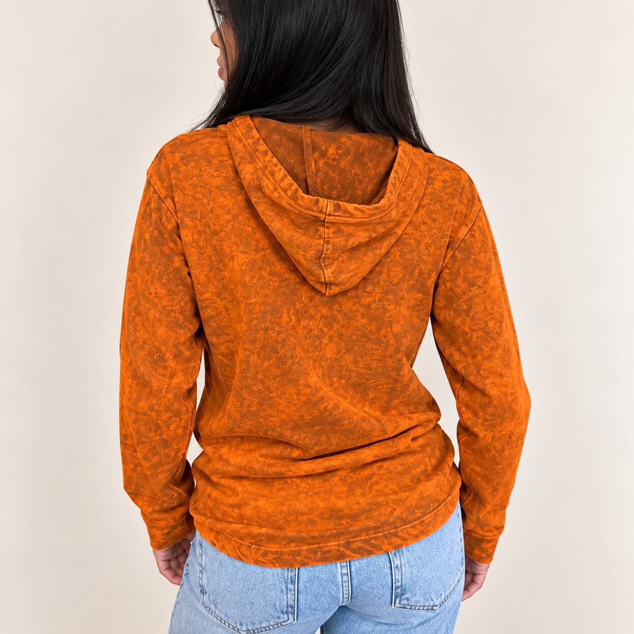 Burnt orange stone washed hoodie with black chest motif