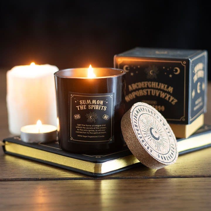 White sage candle in glass with a talking board inspired design