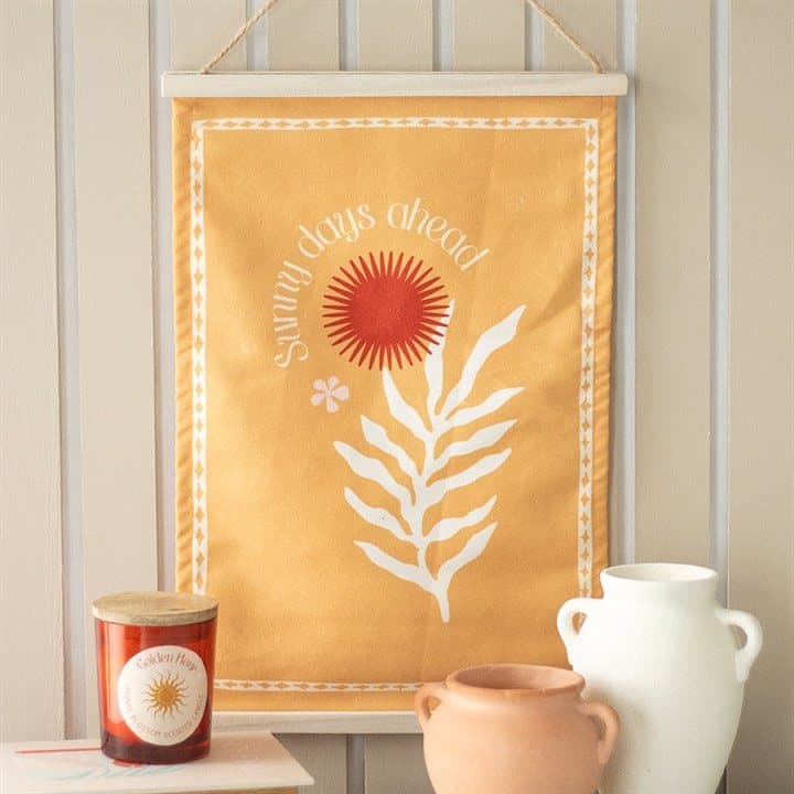 Orange cotton Sunny Days Ahead wall hanging with sun and leaf flower pattern