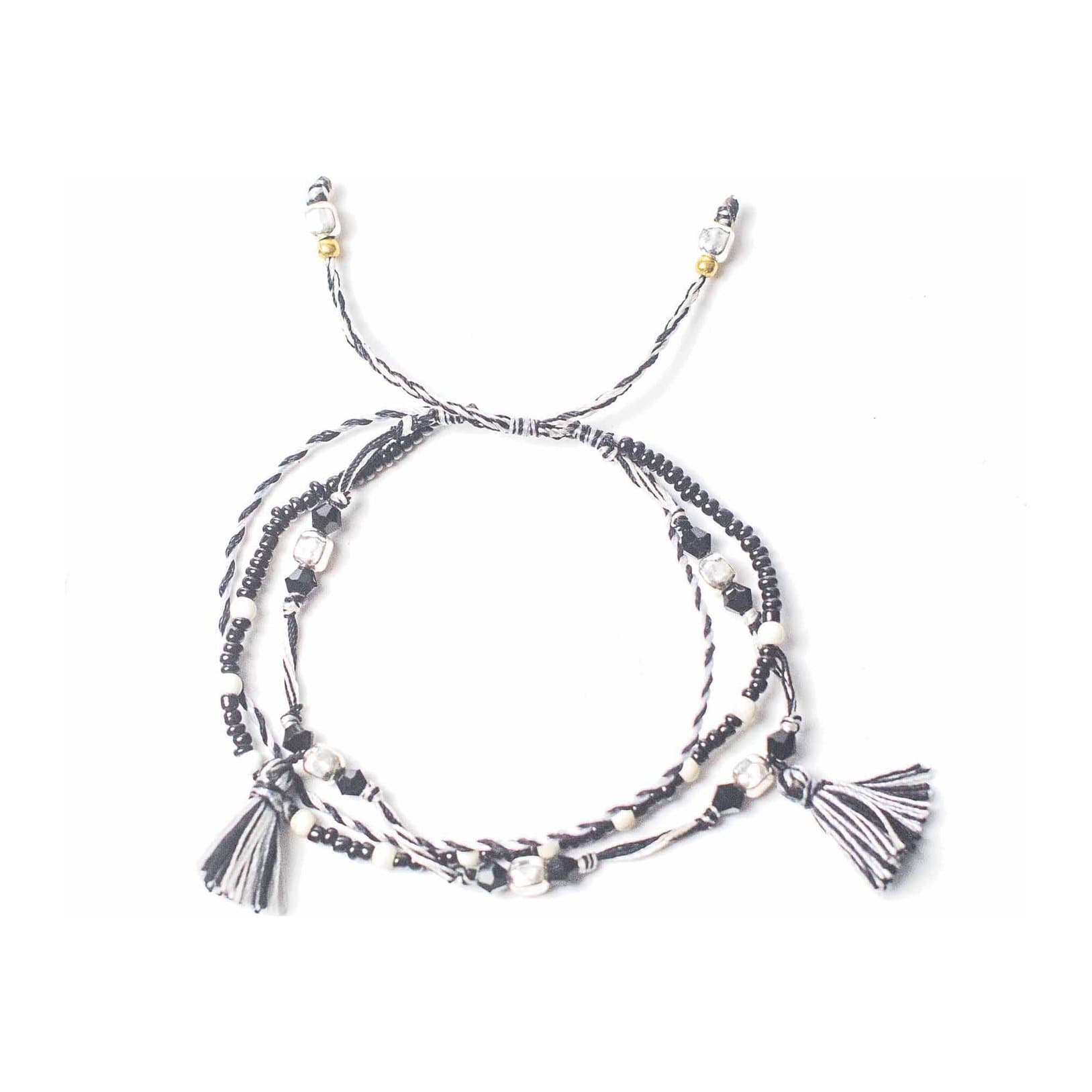 Black and white string bracelet with small silver beads