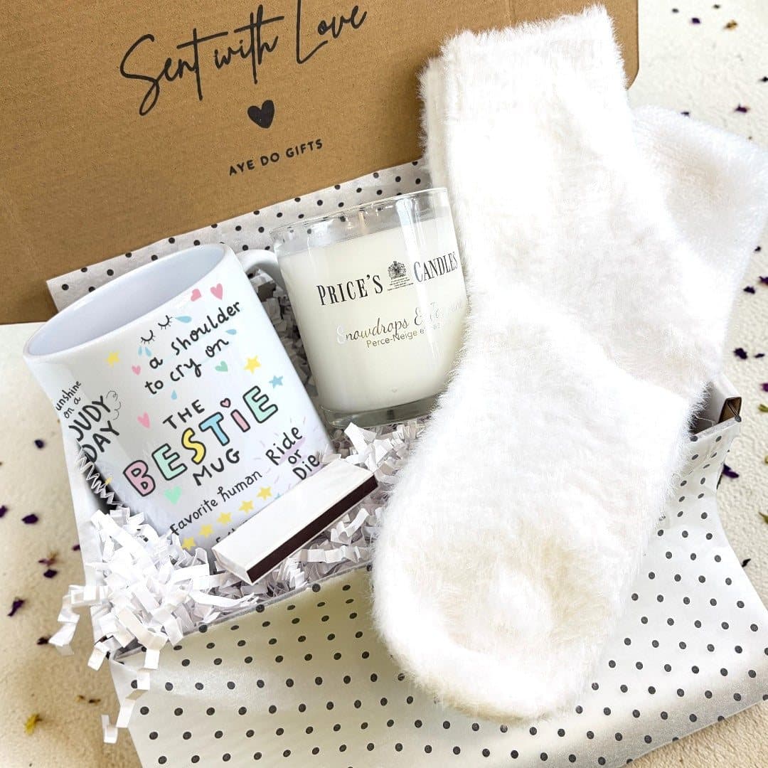 Bestie gift hamper with a colourful ceramic mug, fluffy socks and a scented candle