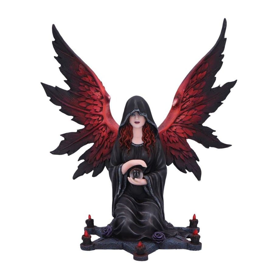 Dark angel figurine kneeling on a star with a crystal ball and red wings