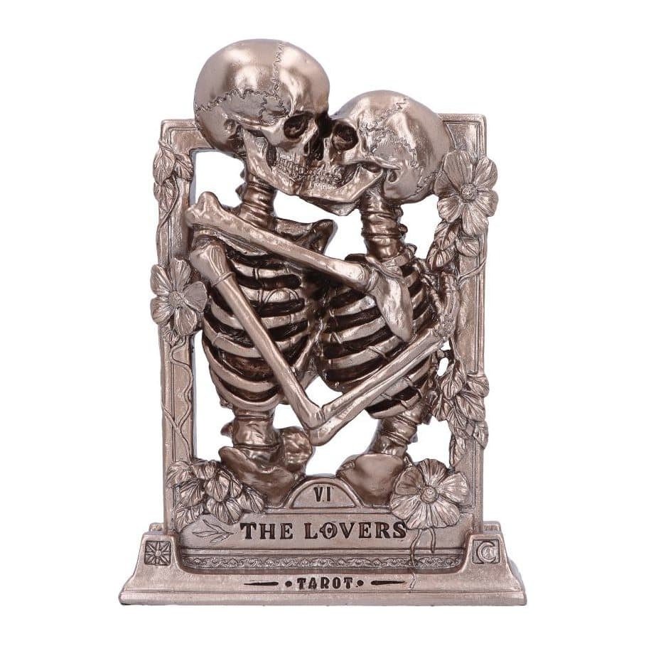 Bronze skeleton lovers kissing in a frame of flowers and foliage