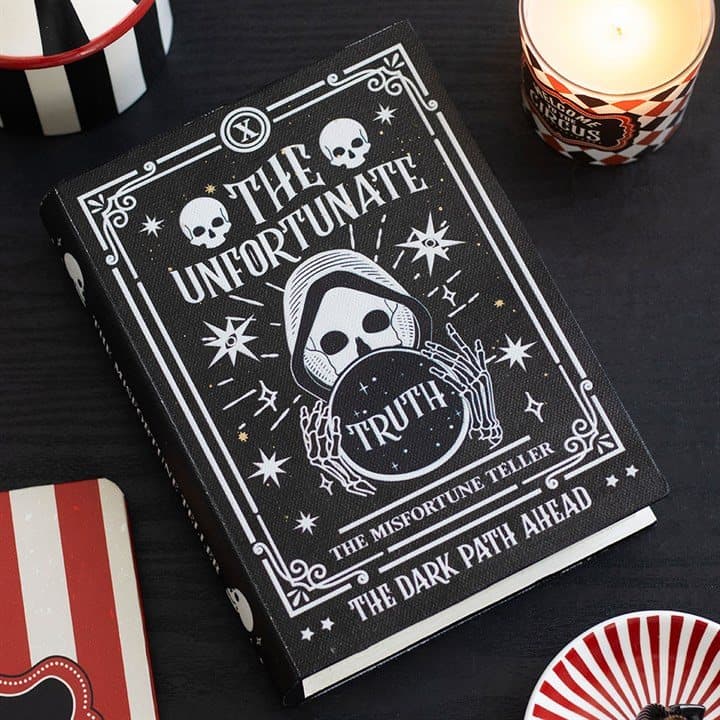 Book shaped storage box with a fortune teller and warnings on the lid