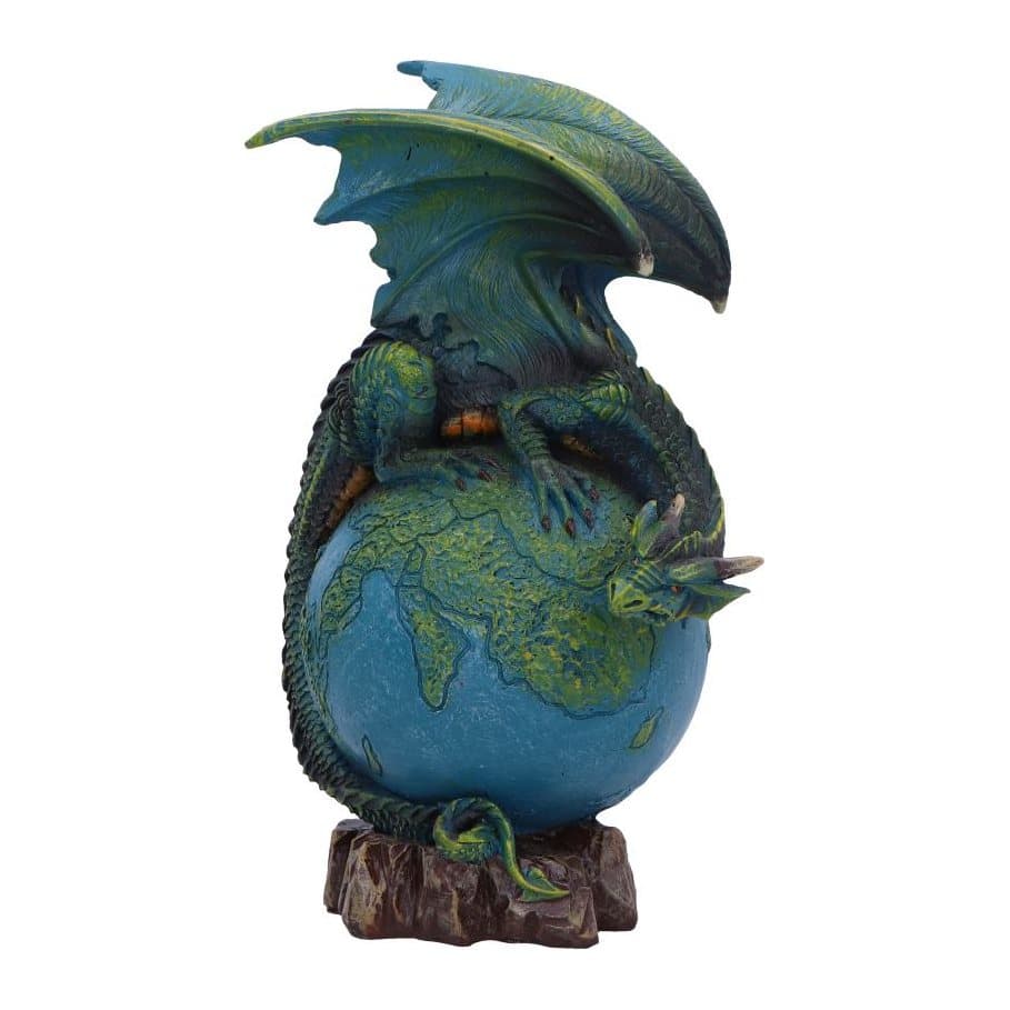 Green dragon figurine resting on a painted model of Earth