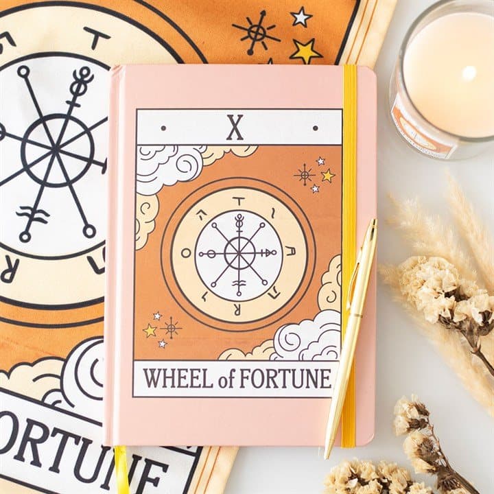 A5 notebook with a vintage Wheel of Fortune tarot card design on the cover