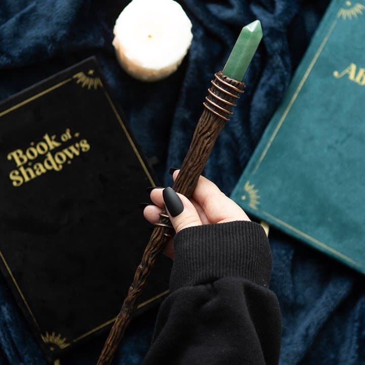 Thin magic wand with a green aventurine crystal point