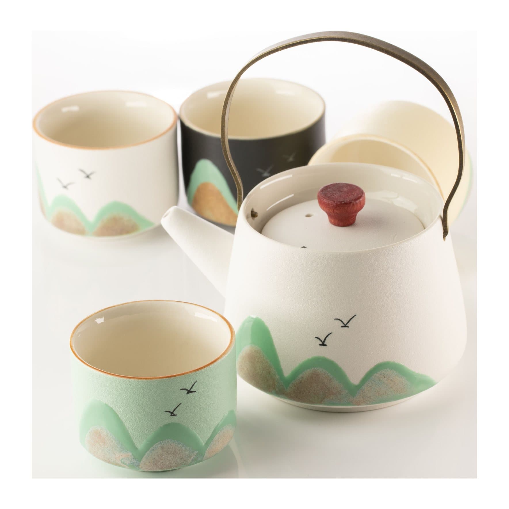Ceramic teapot with bamboo grip, four cups and ceremonial cloth