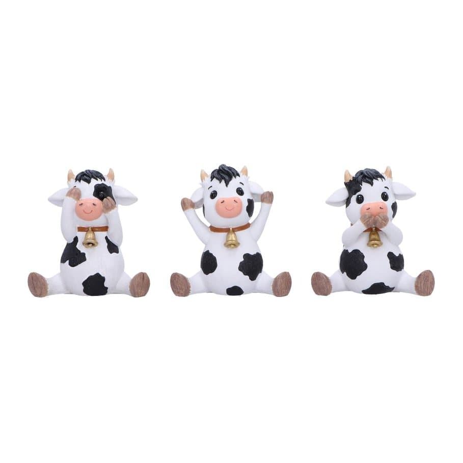Three resin cow figurines in see no, hear no and speak no evil poses