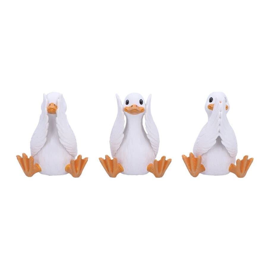 Three white resin geese figurines in see no, hear no and speak no evil poses