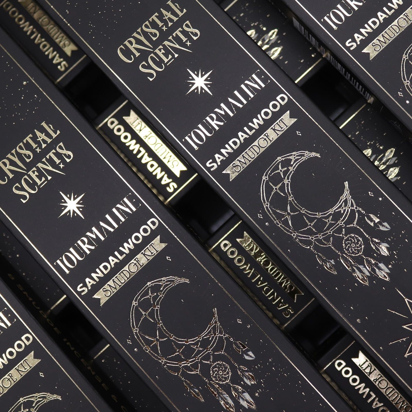 Sandalwood smudge incense sticks in a black sleeve with moon and dreamcatcher motifs