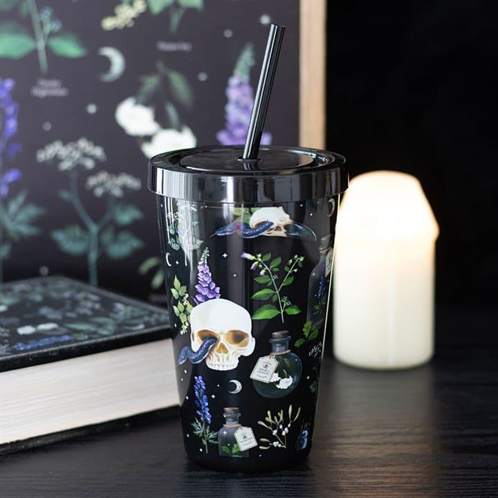 Tumbler with a straw and a skull and poison plant print