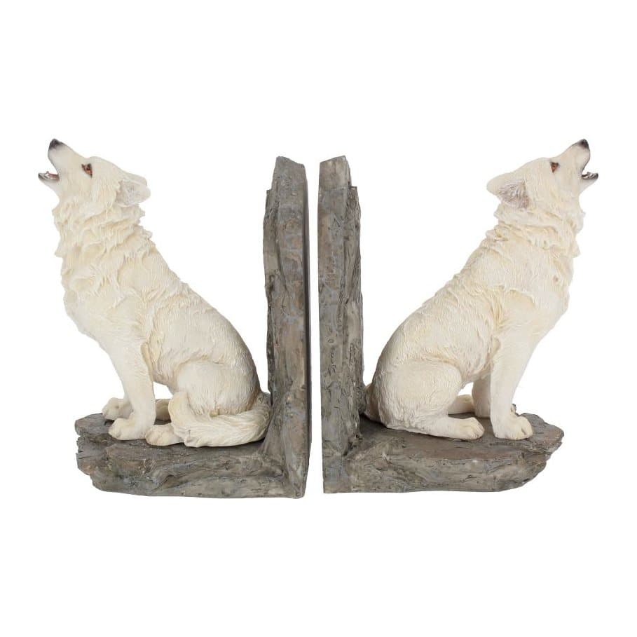 White wolf bookends on a rocky outcrop with orange eyes