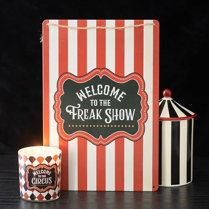Metal hanging sign with bold circus stripes and Welcome to the Freak Show text