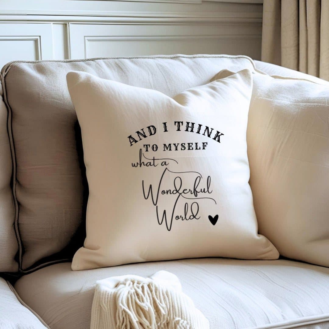 Cream square cushion with the words "And I think to myself what a wonderful world"