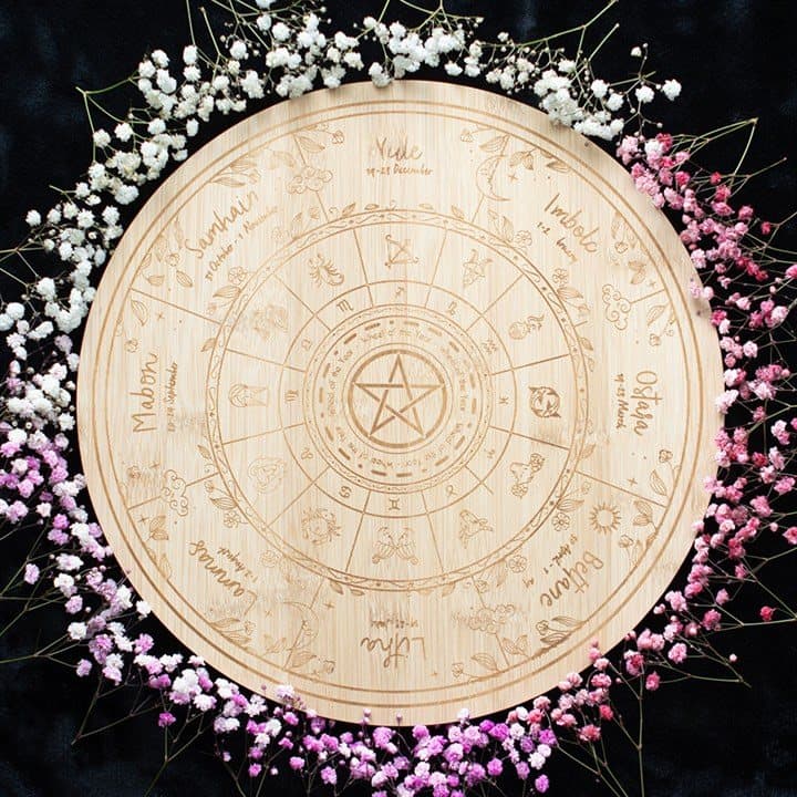 Wooden serving board engraved with the Wheel of the Year