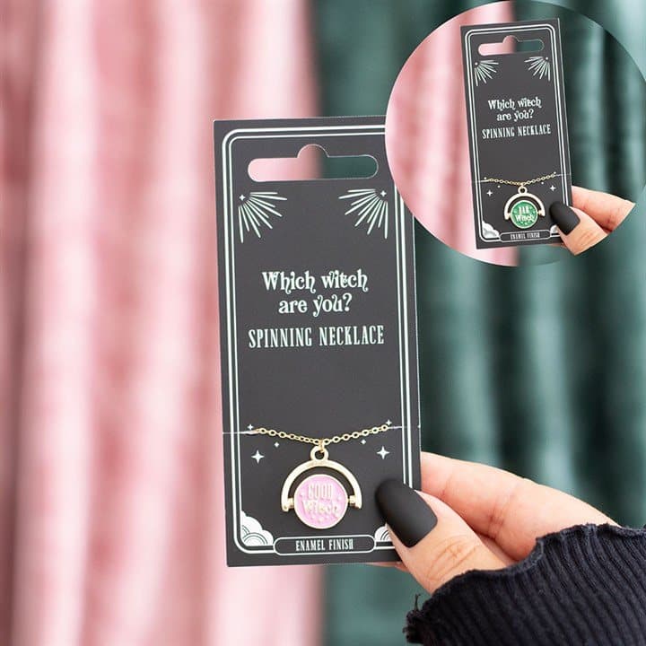 Which Witch Are You spinning necklace with an enamel design on a card