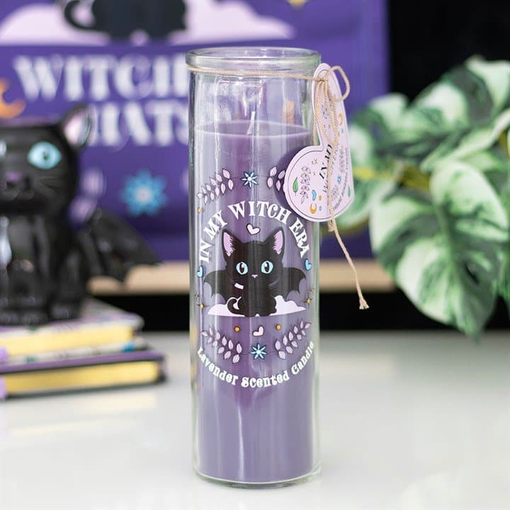 Pillar candle with a bat-winged black cat