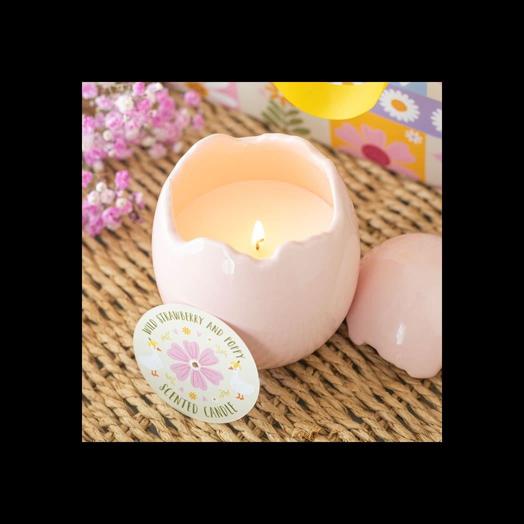 Candle shaped like a cracked pink egg