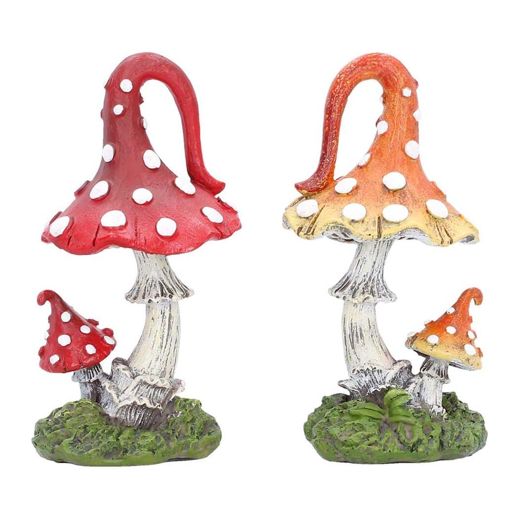 Two fantasy mushroom sculptures in orange-yellow and purple-blue on grassy bases