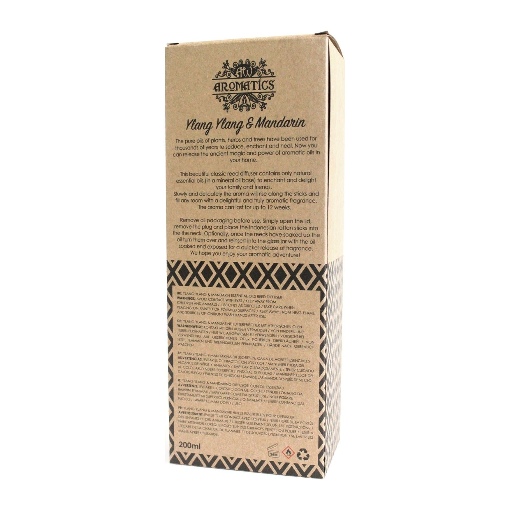 Ylang ylang and mandarin reed diffuser in a glass jar with rattan sticks