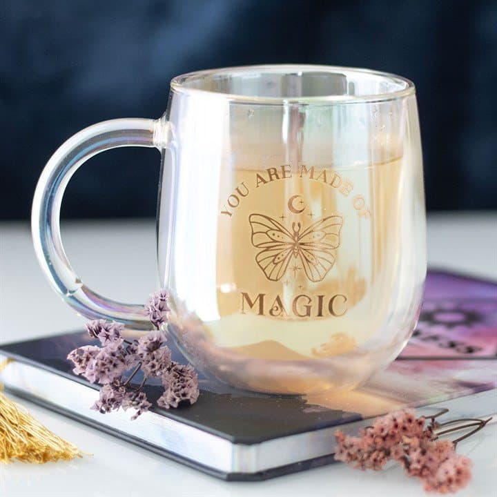 Double walled glass mug with a butterfly and gold magic words
